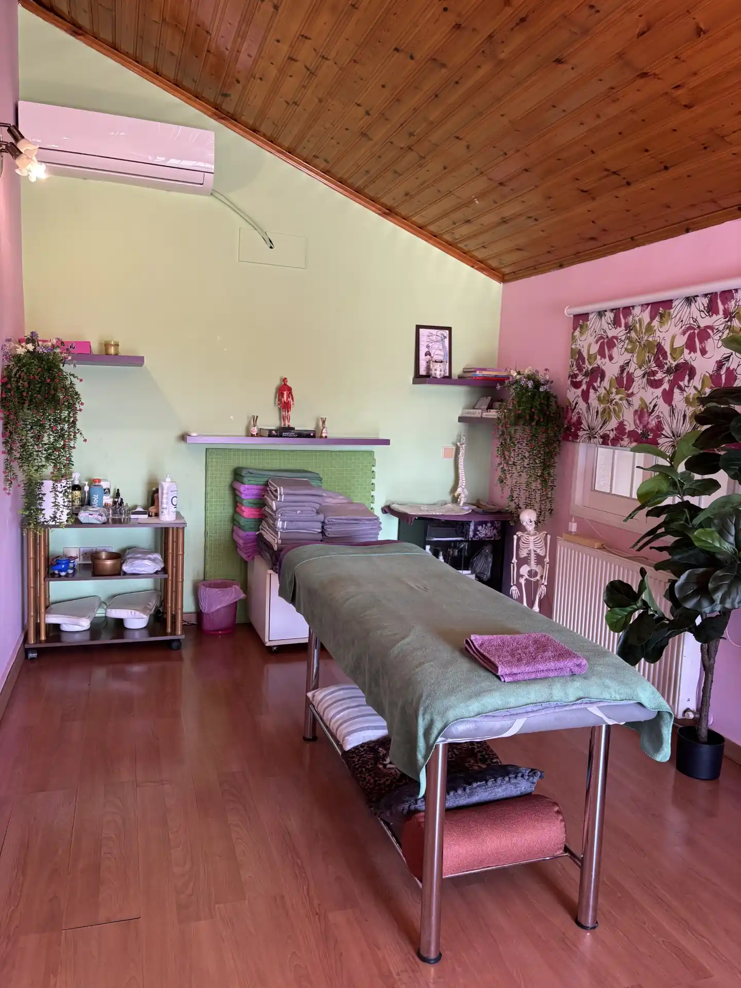 Treatment room with diplomas and certificates displayed on wall
